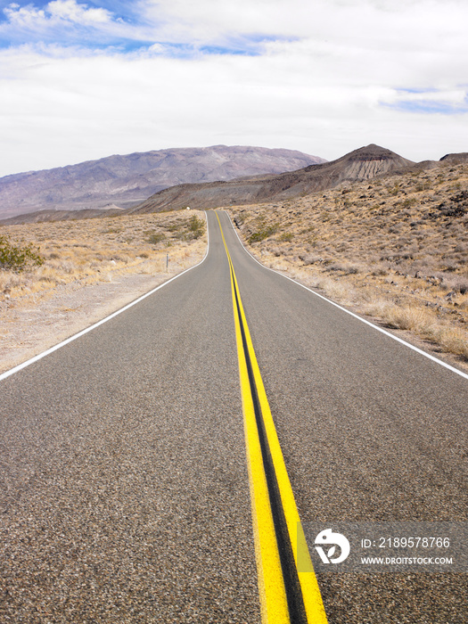 Two Lane Highway Through Desert Landscape