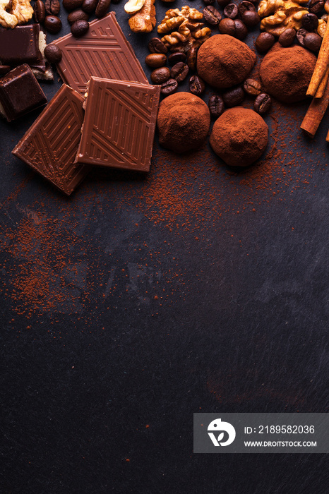 Variety of sweet homemade chocolate pralines on wooden background