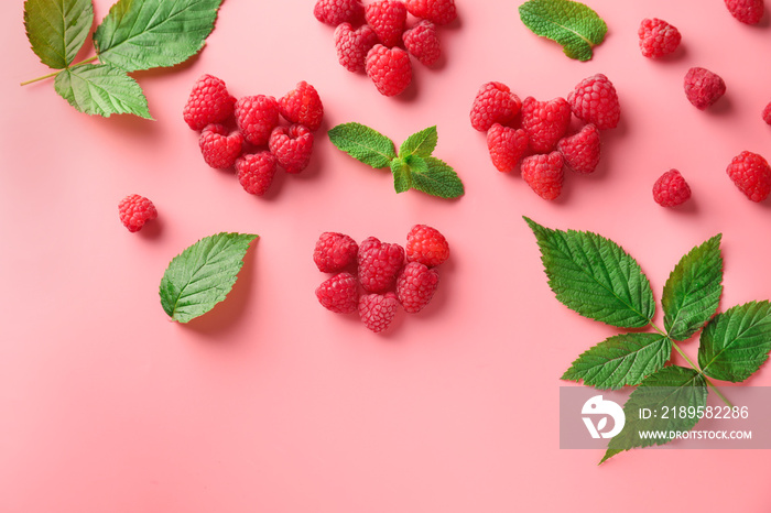 Composition with ripe aromatic raspberries on color background