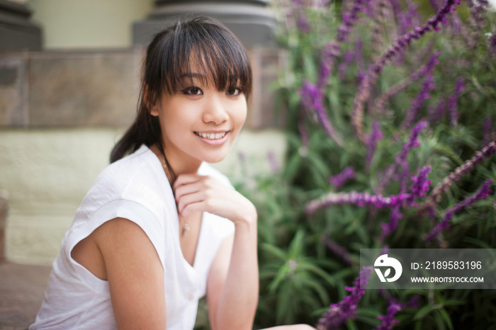 Portrait of young girl outside home