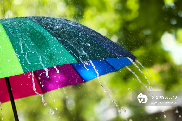 Colorful umbrella outdoors on rainy day