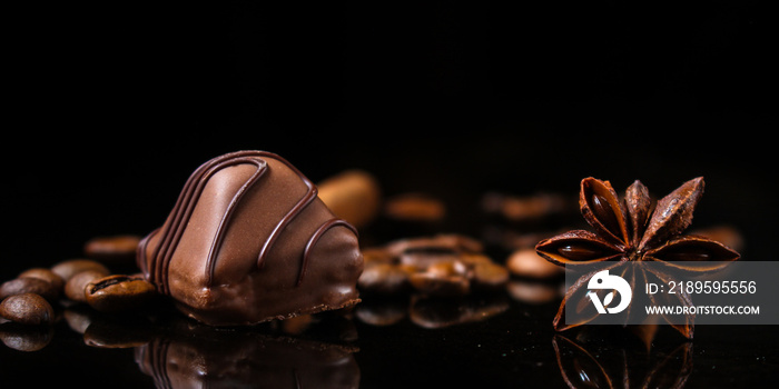 candy, chocolate, filler, cream, coffee  (Black background). food background. copy space