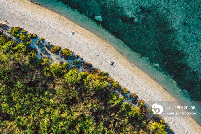 Top down view of tropical landscape with turquoise water and white sand