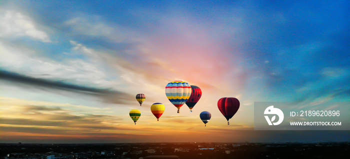 Hot air balloons flying over the sunrise mountain at phucheefa mountain. Chiang Rai Province, Thaila