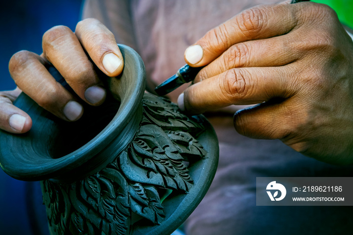 close up potter artist working on clay pottery sculpture fine art in thailand