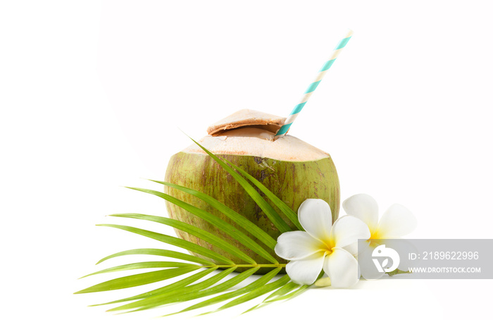 Fresh coconut drink with plumeria flower and paper straw isolated