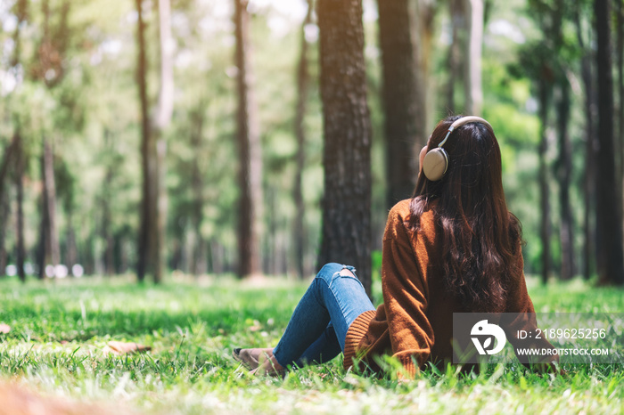 A beautiful asian woman enjoy listening to music with headphone with feeling happy and relaxed in th