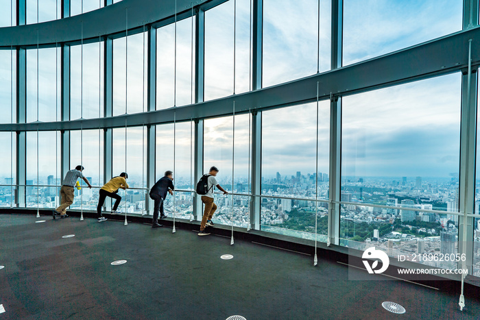 People silhouette inside Observation Deck. Tokyo, Japan.