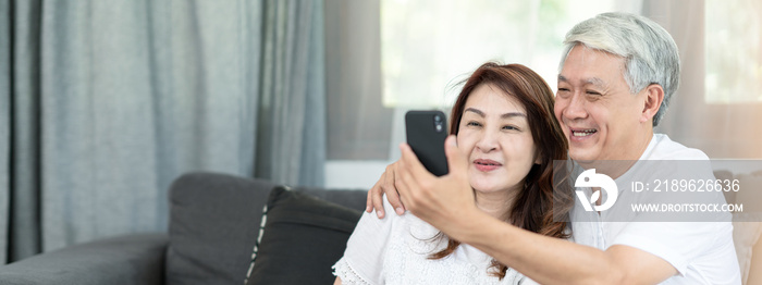 Candid of attractive old asian couple husband and wife us technology for video call via smartphone 5