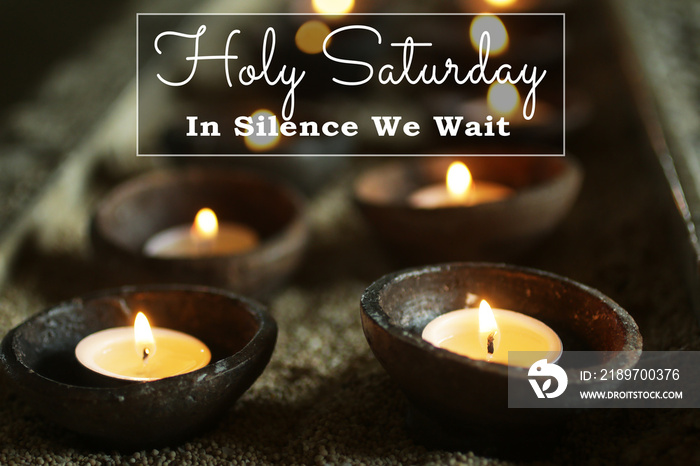 Holly Saturday. In silence we wait. Happy Holy Saturday concept with burning candles in ceramic bowl