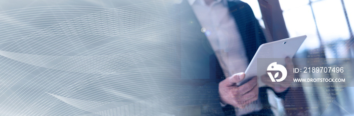 Businessman with tablet, light effect, double exposure. panoramic banner