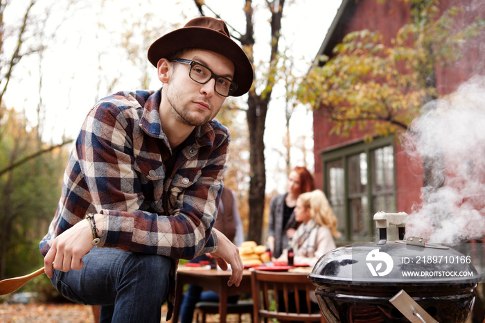 Young man posing at holiday cook out