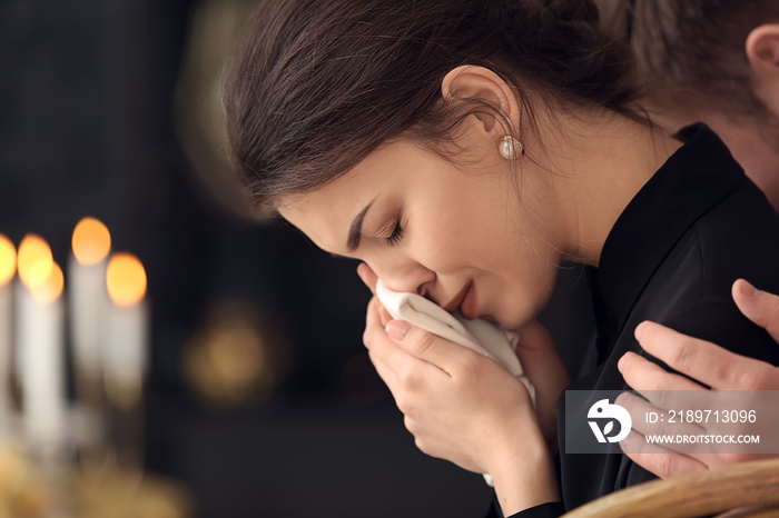 Young pining woman at funeral