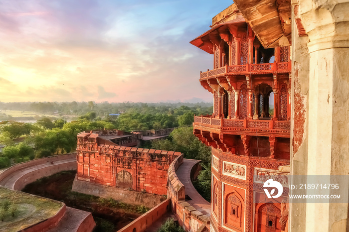 Agra Fort - Famous medieval historic fort exterior structure with view of Agra city landscape at sun
