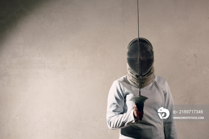 Fencer woman with fencing sword.