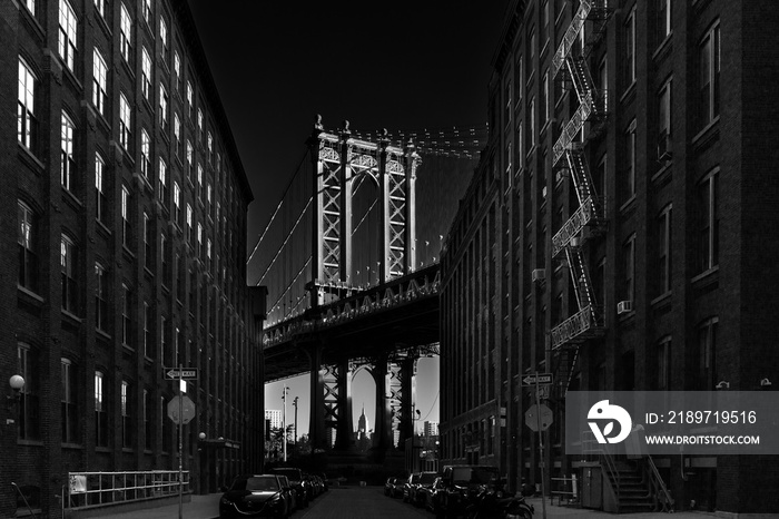 Manhattan Bridgeas at dusk as seen from Washington street in Brooklyn, New York City, USA. Motion bl