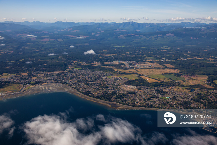 Aerial view of a small town, Parksville, on Vancouver Island during a sunny summer morning. Taken ne