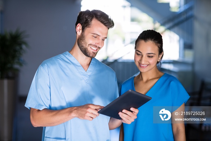 Doctors using digital tablet