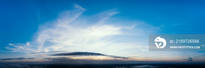 Dawn or sunset over the clouds, blue hour, aerial view.