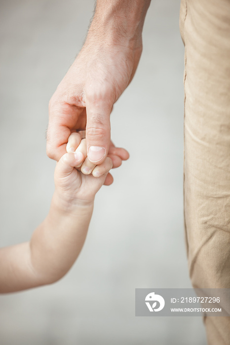 Young father walking with his little child outdoors. Dad taking care of his daughter. Father`s and d