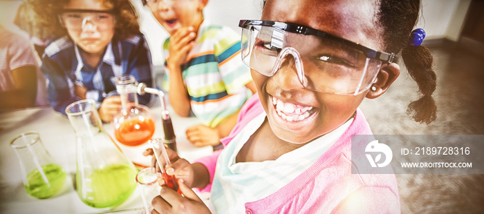 Kids doing a chemical experiment in laboratory