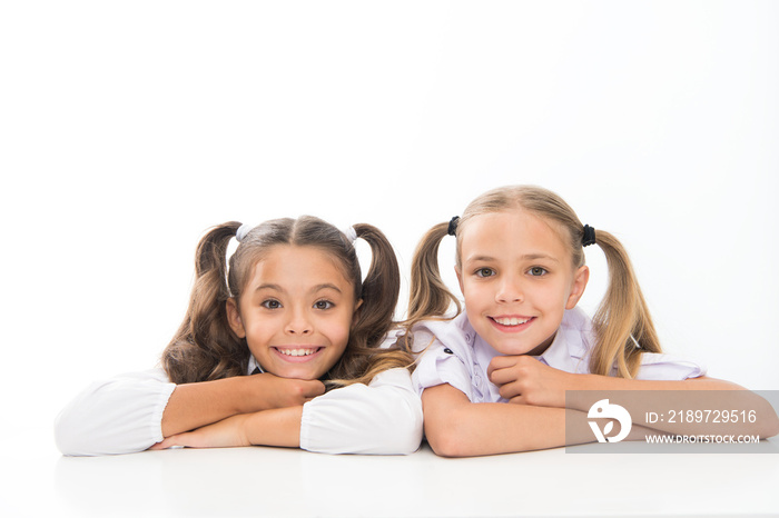 Beautiful and smart. School girls in pigtails. Cute little girls smiling isolated on white. Happy sm