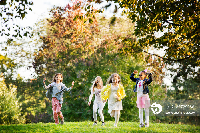 View of children ( 6-7, 8-9 ) playing in park