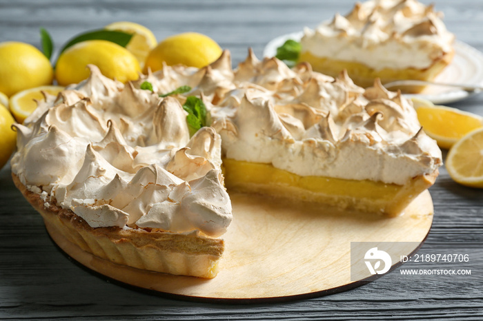 Yummy lemon meringue pie on wooden table