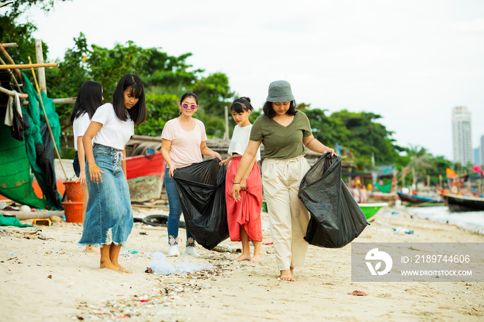 group of volunteer keep clean on sea beach