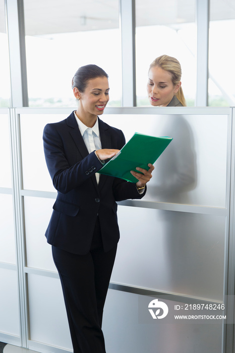 Corporate businesswomen talking in office