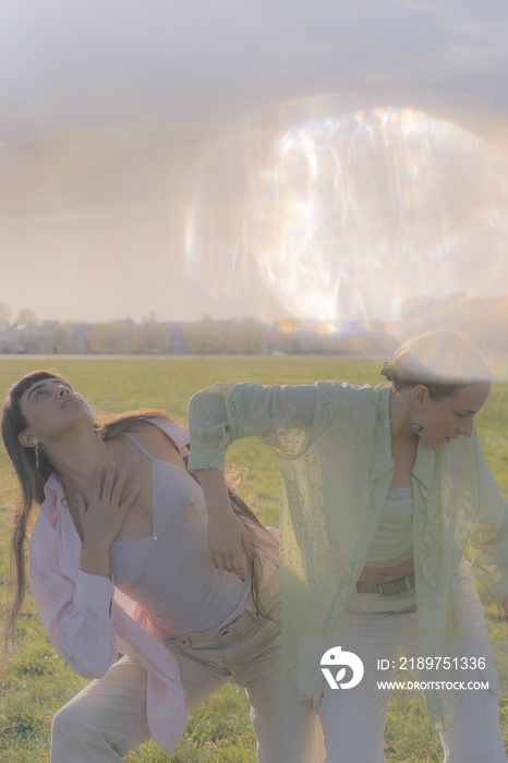 women in nature dancing