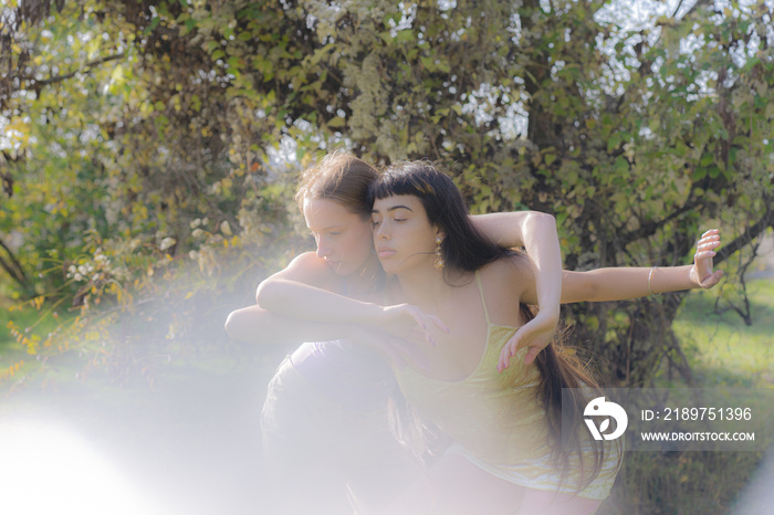 women in nature dancing