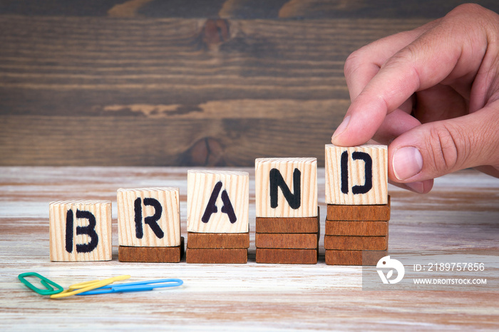 Brand concept. Wooden letters on the office desk, informative and communication background.