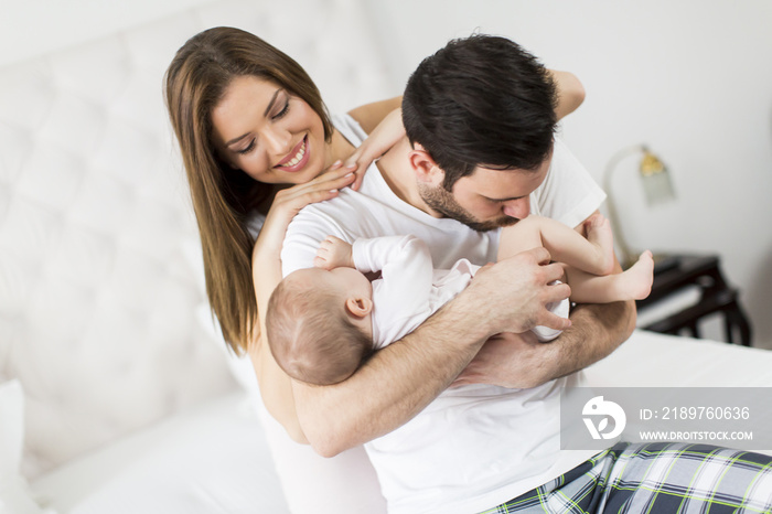 Happy family with newborn baby