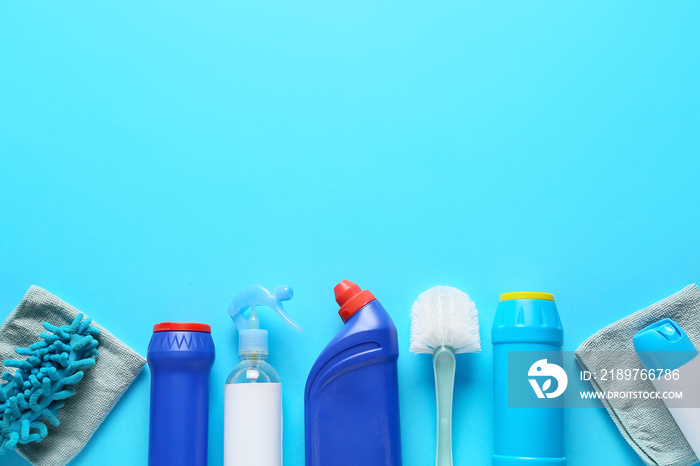 Set of cleaning supplies on color background