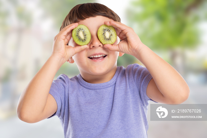 Little boy child with kiwi fruit having fun town happy happiness healthy eating