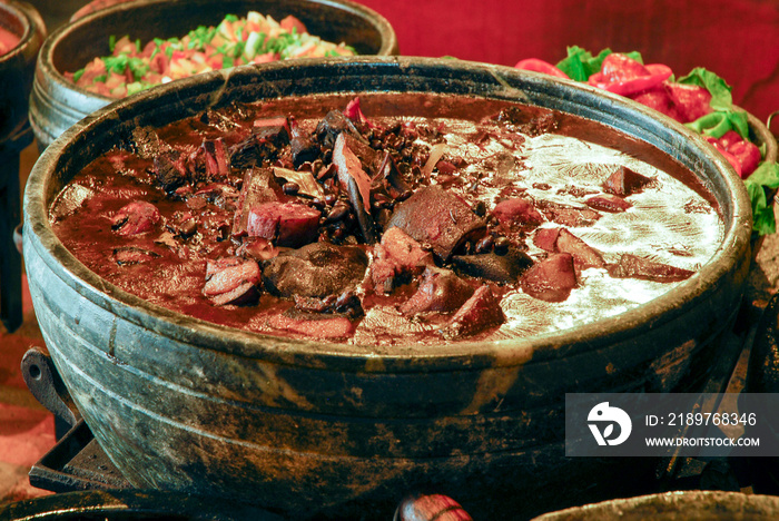 feijoada cooked in a wood stove with rice and farofa