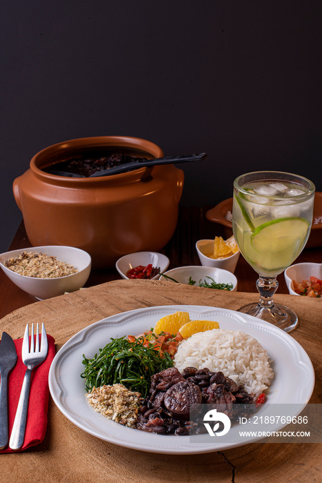 Typical Brazilian dish called Feijoada. Made with black beans, pork and sausage