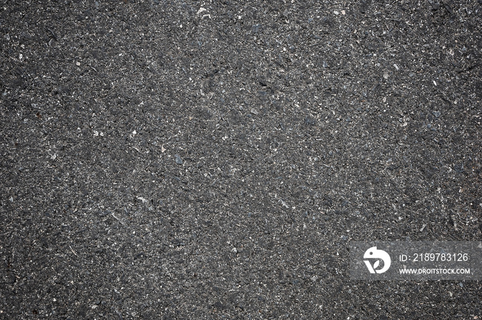 A smooth dark grey asphalt pavement texture with small rocks,Asphalt Dark Texture for Roads,Soil tex