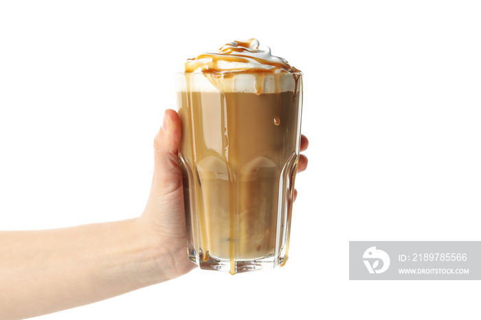 Female hand holds iced coffee with poured cream isolated on white background