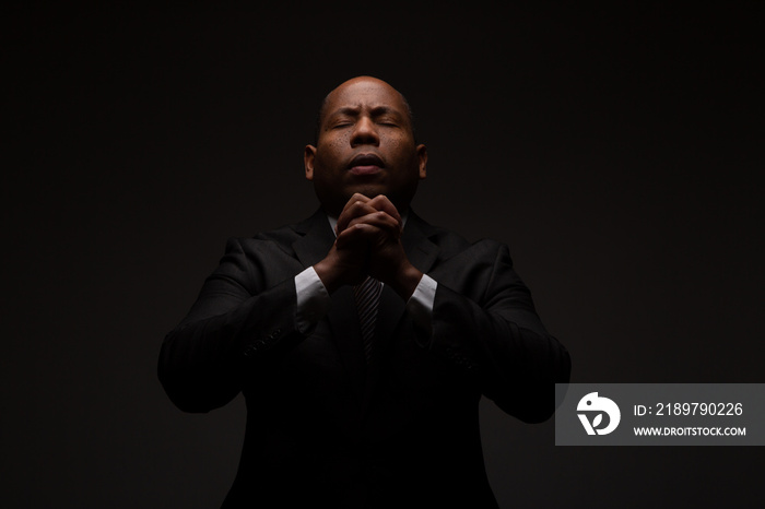 African American Christian Man Praying and Seeking Guidance from God