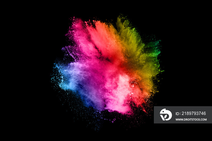 Explosion of colored powder on black background