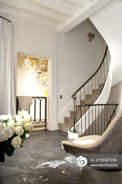 Chair and spiral staircase in middle class house