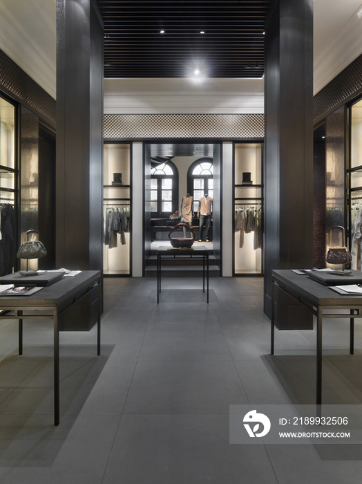 Interior of clothes store with purses on display