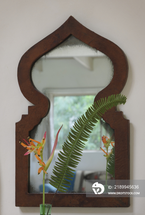 Close-up of mirror hanging on wall