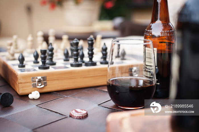 Close-up of cropped chess game against blurred potted plant; Rancho Sante Fe; USA