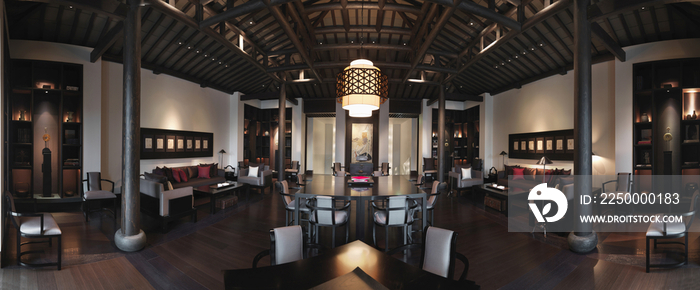 Lamp hanging above dining table in elegant restaurant