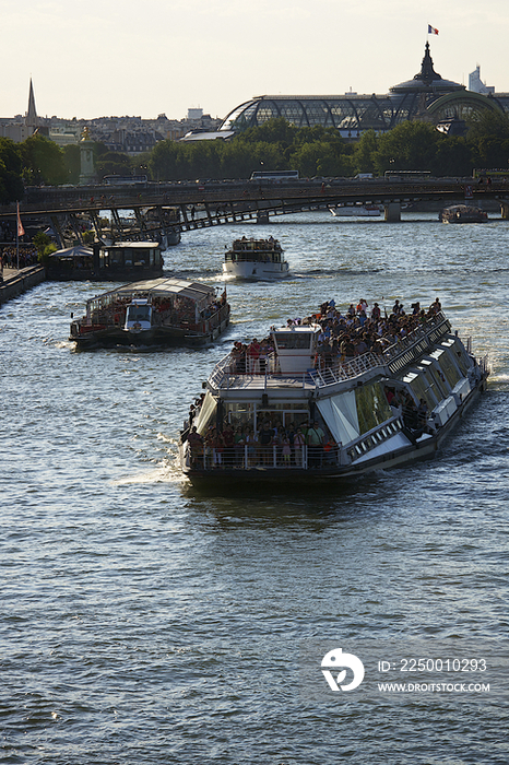 Tourist ship running through River Seine