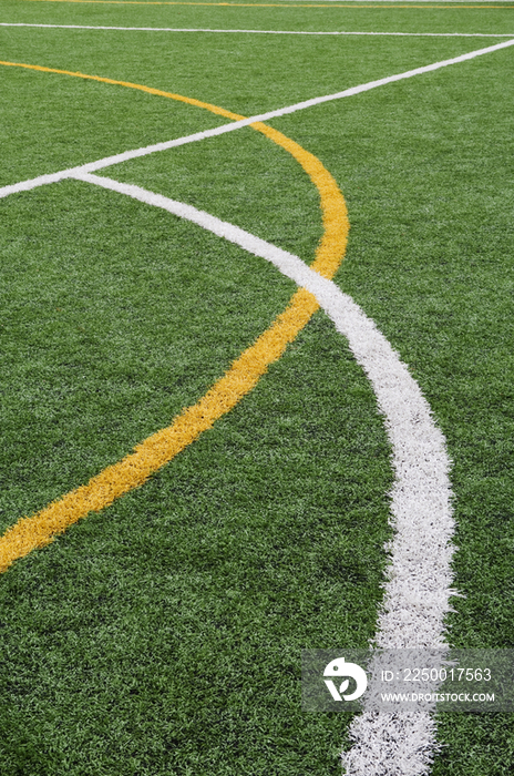 Lines painted on the astro turf sports ground of a modern secondary school