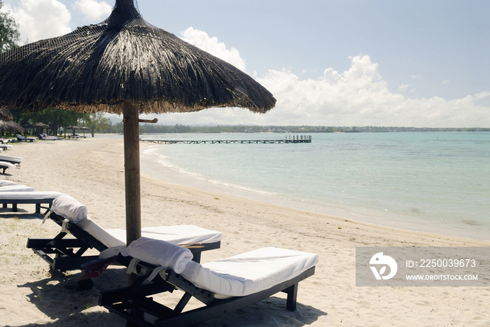 Beach chairs on beach in Mauritius, Africa